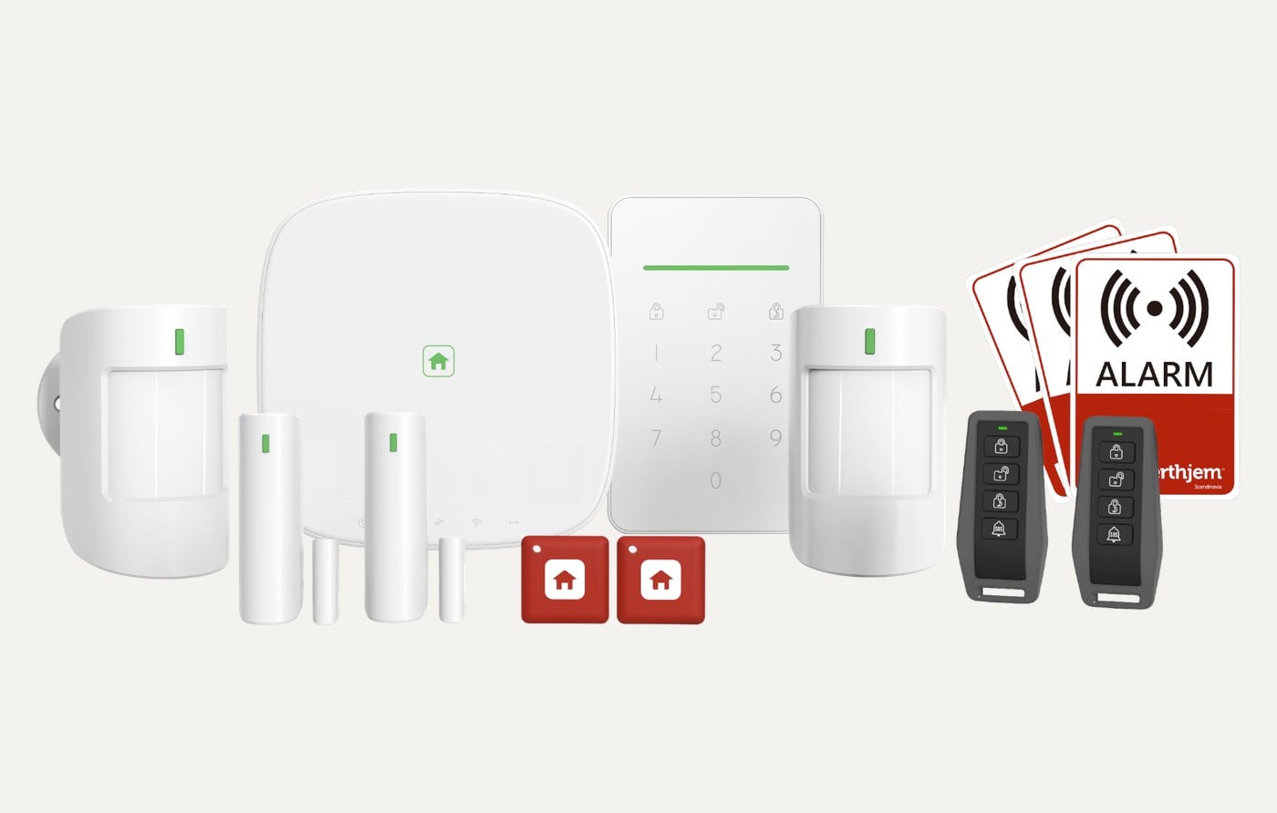 Indholdet af SikkertHjem S7pro villapakken med SmartBox, SmartPad, sensorer, fjernbetjeninger, nøglebrikker og alarmmærkater